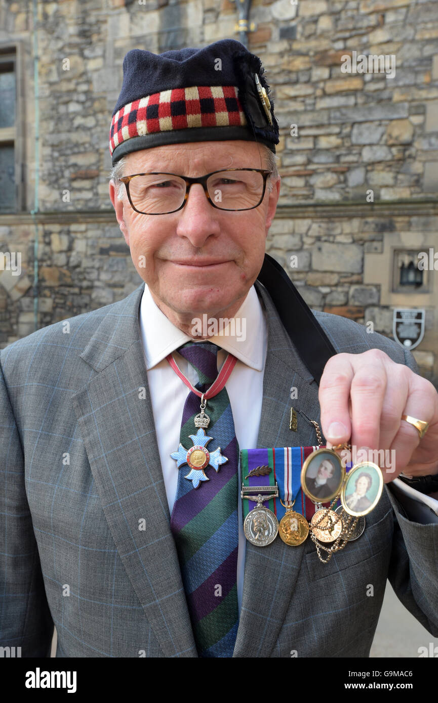Major General Mark Strudwick holds a locket which his grandmother wore throughout the First World War containing a picture of herself and her husband, after attending a special service, which followed an overnight vigil, held at Edinburgh Castle, as Scotland marks the 100th anniversary of the Battle of the Somme. Stock Photo