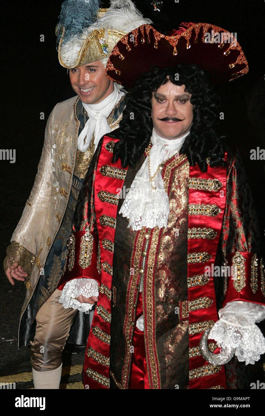 Singer Elton John (right) and his partner David Furnish (left) arrive at the pantomime-themed reception for the civil partnership between Matt Lucas and his long-term partner Kevin McGee, at Banqueting House in Whitehall, London. Stock Photo