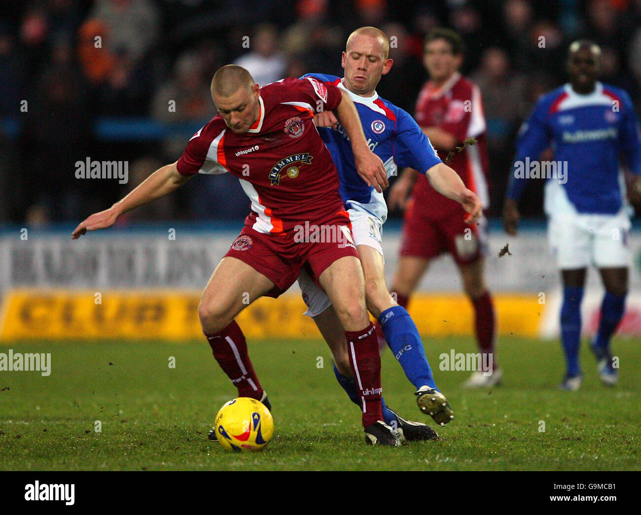 Chesterfield's Derek Niven challenges Blackpool's Andy Wilkinson (front) during the Coca-Cola League One match at the Recreation Ground, Chesterfield. Stock Photo