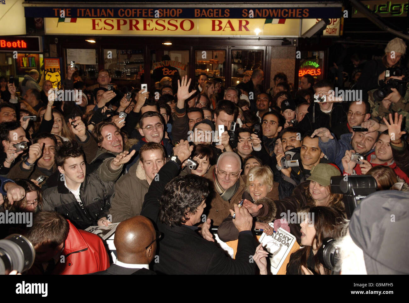 Fans mob Sylvester Stallone as he arrives for the UK Premiere of Rocky Balboa at the Vue Leicester Square in central London. Stock Photo