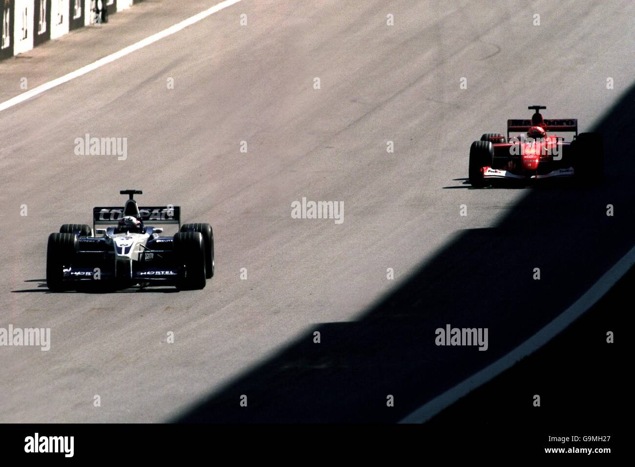Michael Schumacher chases Juan Pablo Montoya during the Austrian Grand Prix Stock Photo