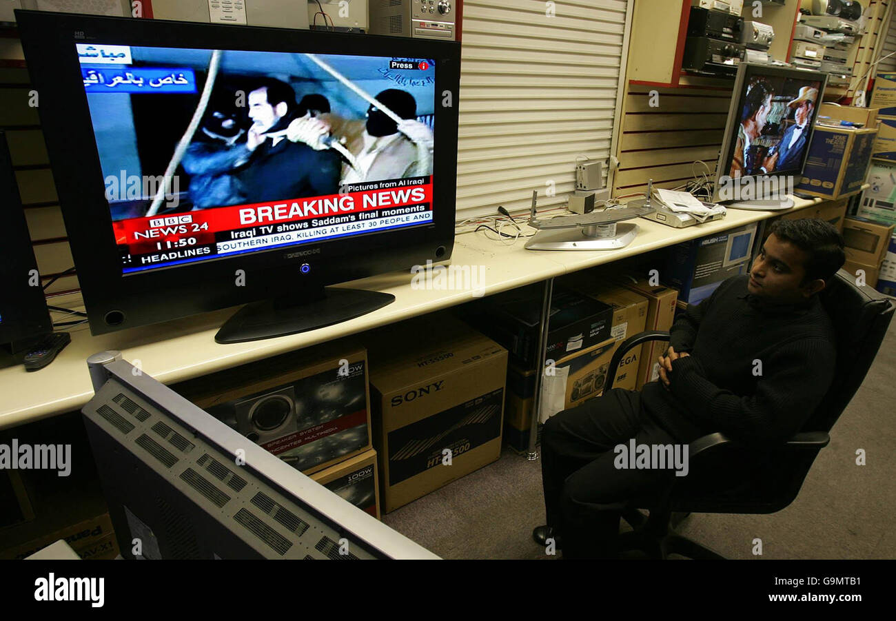 A boy watches a television in an electrical store in central London, as broadcasters show the moments leading up to the execution of Saddam Hussein that occurred in Iraq earlier today. Stock Photo