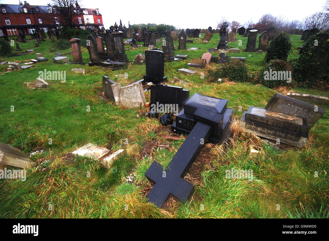 A cemetery in the Beeston area of Leeds with numerous damaged gravestones. Stock Photo