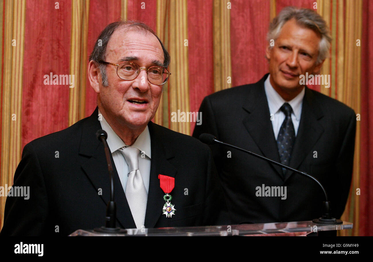 Nobel-winning British playwright Harold Pinter (left) speaks after being awarded the French Legion d'honneur by French Prime Minster Dominique de Villepin (right) at the French Embassy in London. Stock Photo