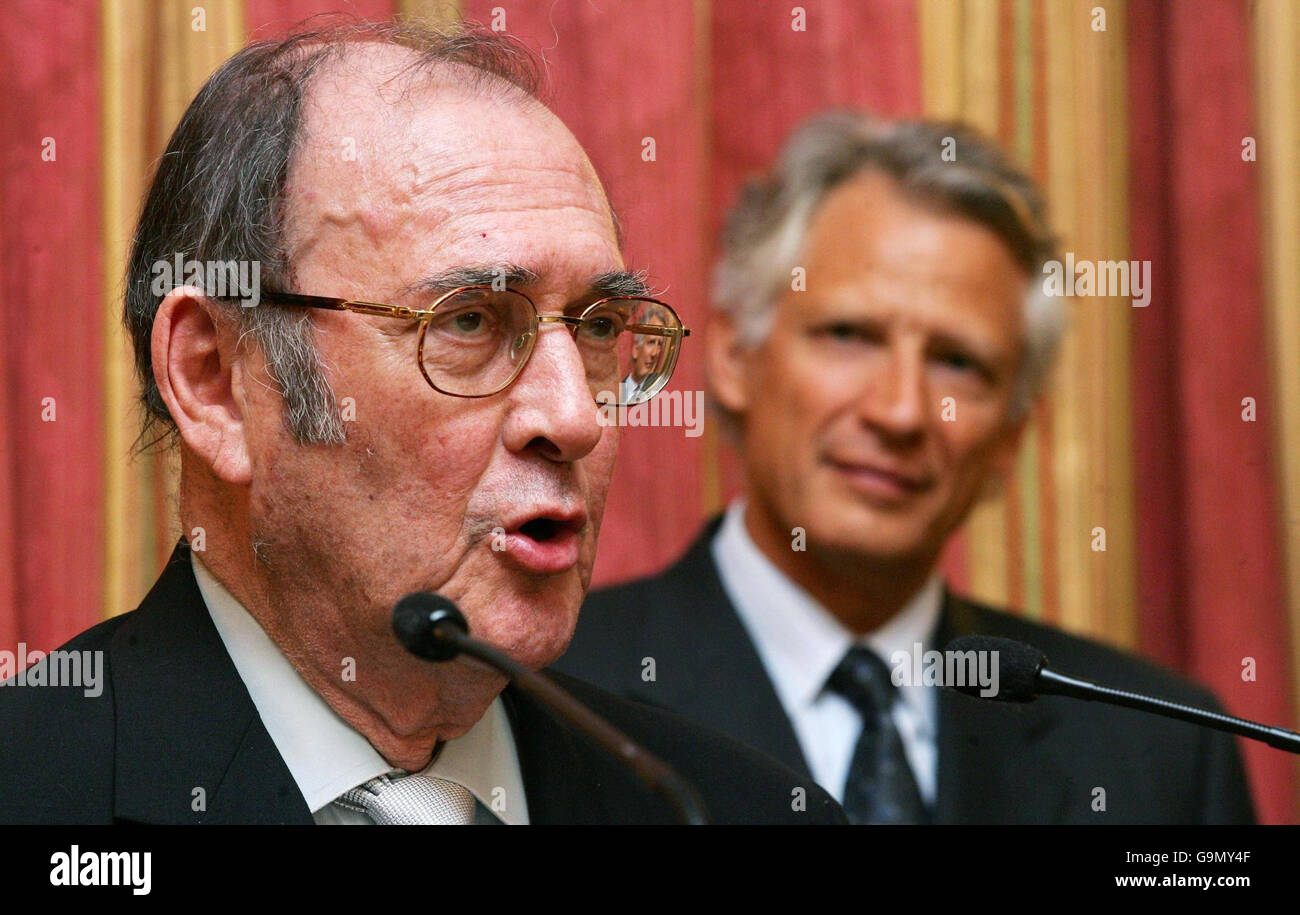 Nobel-winning British playwright Harold Pinter (left) speaks after being awarded the French Legion d'honneur by French Prime Minister Dominique de Villepin (right) at the French Embassy in London. Stock Photo
