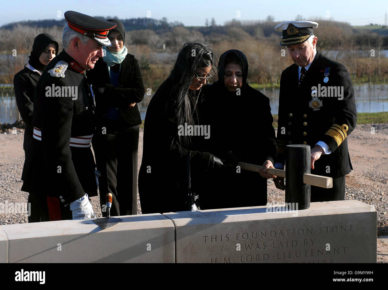 Zoubia Hashmi and Imtiaz Bano, the sister and mother (respectively) of Lance Corporal Jabron Hashmi who was killed in Afghanistan in July 2006, lay a stone during a ceremony at the National Memorial Arboretum today. Stock Photo