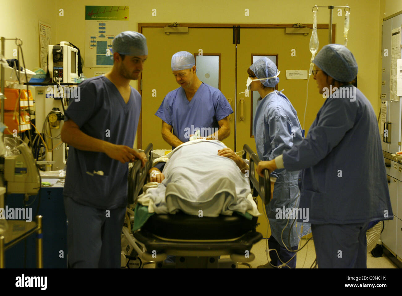 Operating Theatre staff prepare a patient for a Laparoscopic Anterior Resection on a patient at the Royal Hampshire County Hospital in Winchester, Hampshire. Stock Photo