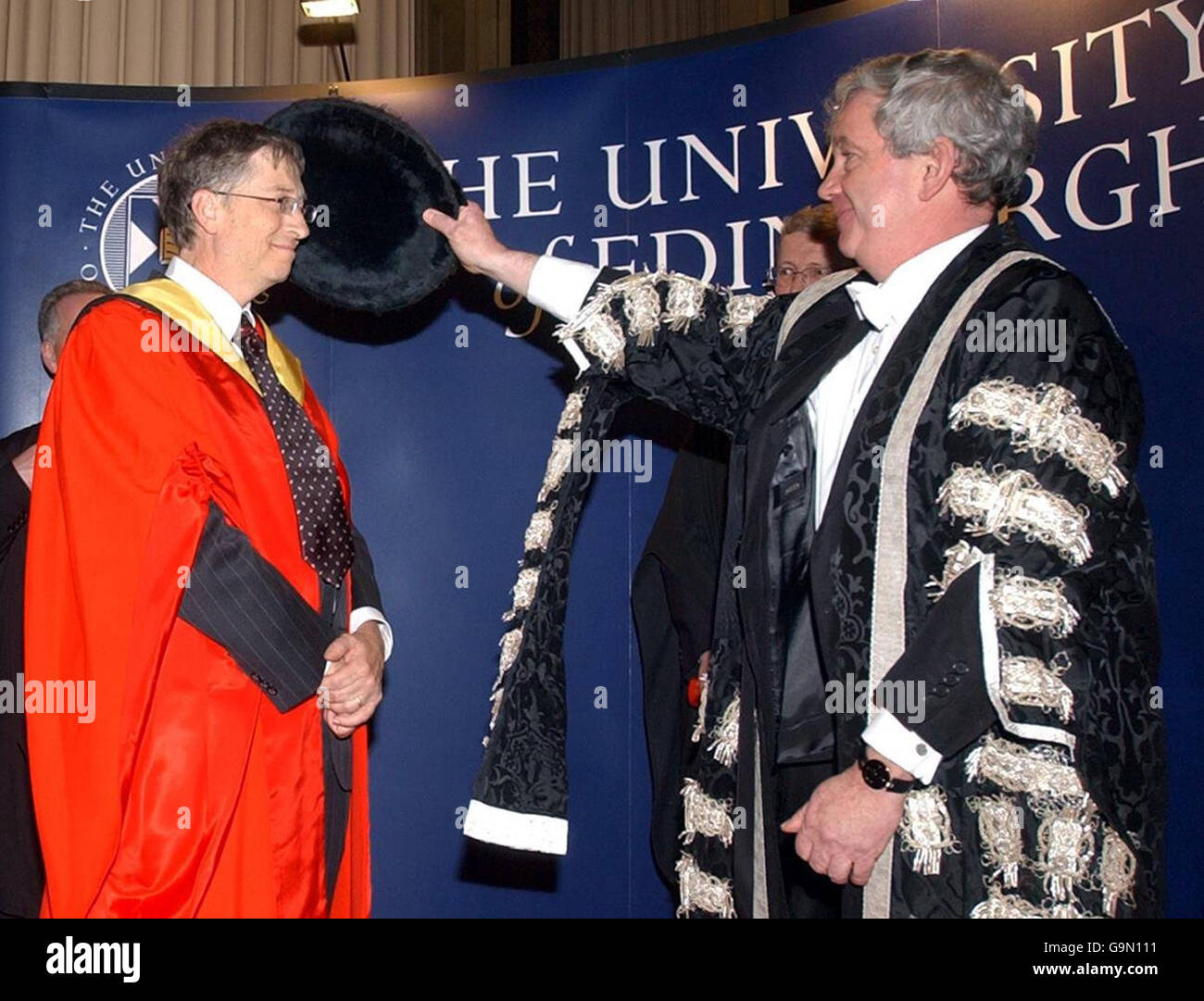 Microsoft chairman Bill Gates receives a honorary degree from principal