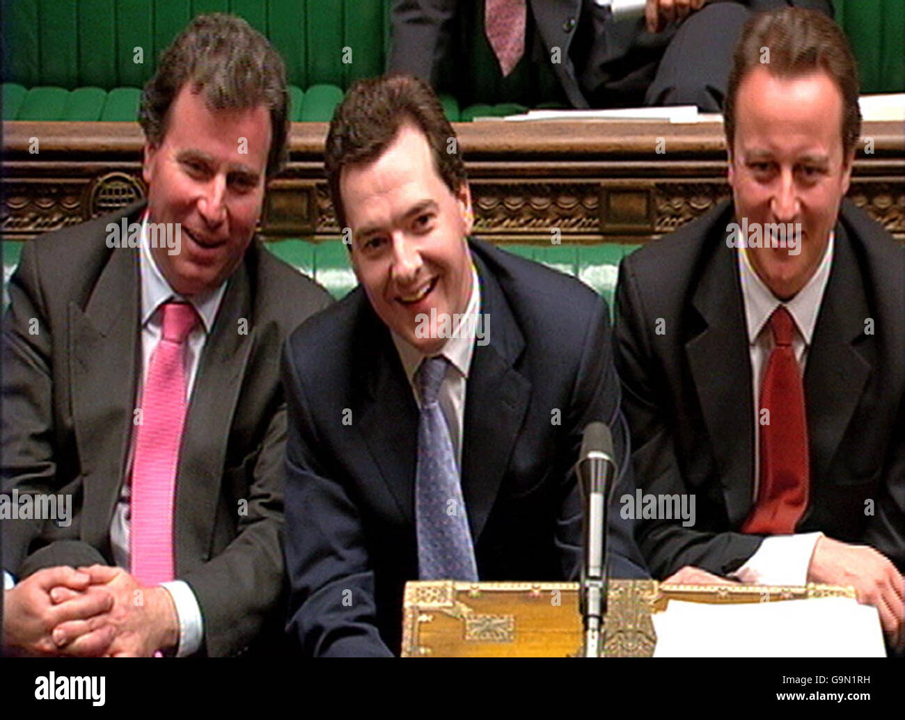 (Left to right); Conservative policy chief Oliver Letwin, Shadow Chancellor George Osborn and party leader David Cameron listen as the Chancellor's responds to questions on his Pre-Budget Report in the House of Commons. Stock Photo
