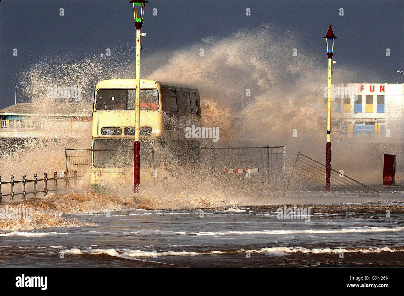 A Bus On Blackpool Promenade Is Engulfed By A Wave As Gale Force Winds a-bus-on-blackpool-promenade-is-engulfed-by-a-wave-as-gale-force-winds