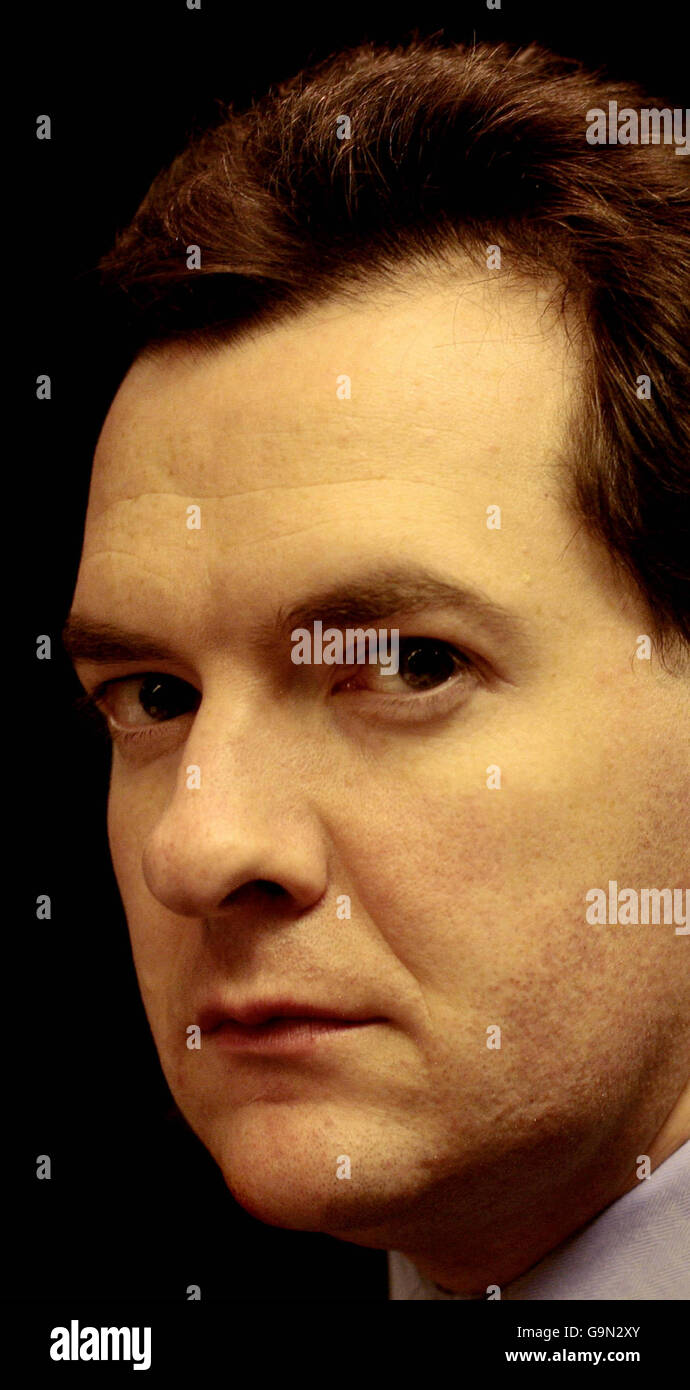 Shadow Chancellor Osborne works while travelling on the train to