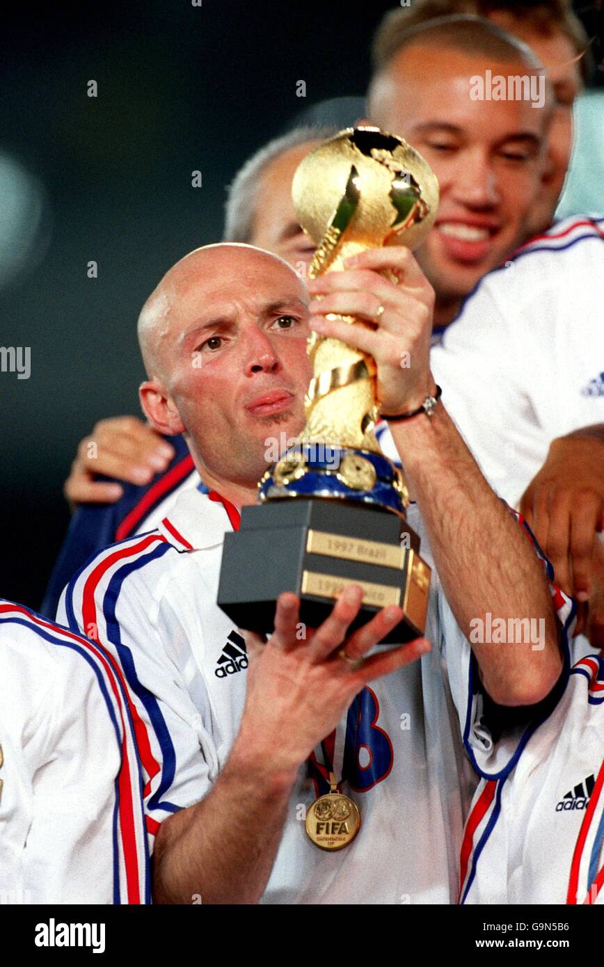 Holds the fifa confederations cup trophy after defeating