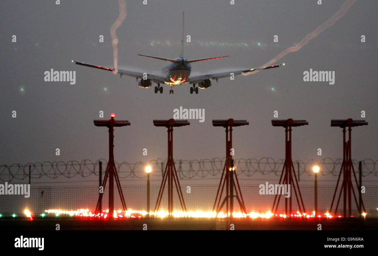 Flights grounded due to fog. An aircraft lands at Heathrow airport this morning. Stock Photo