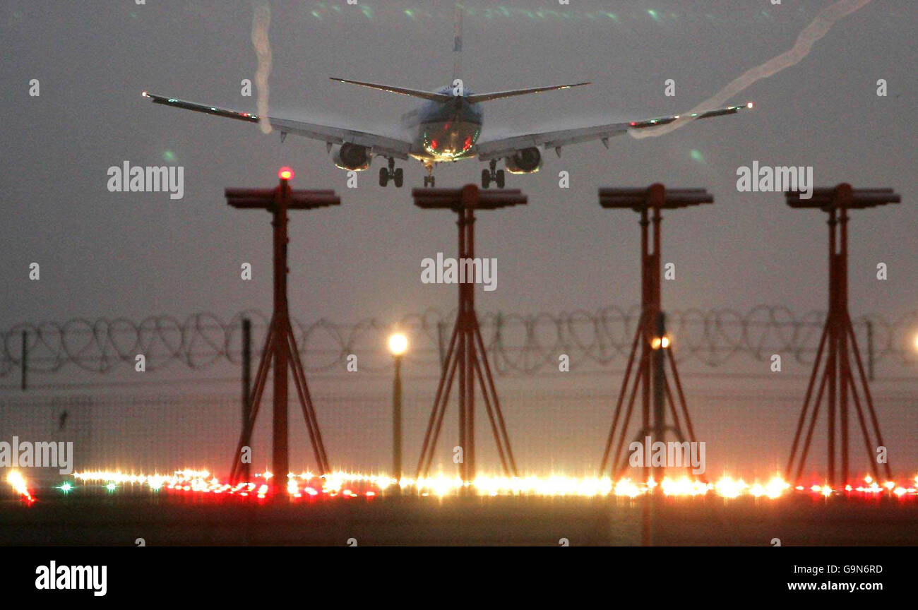 Flights grounded due to fog. An aircraft lands at Heathrow airport this morning. Stock Photo