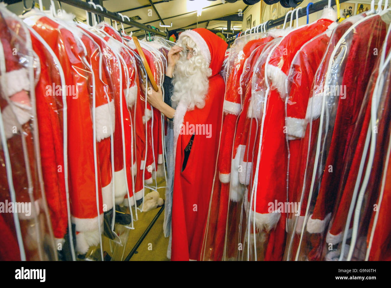 Customers and staff at Mad World, a fancy-dress outfitters near Gatwick, getting ready for the busiest time of the year with Fat Stock Photo