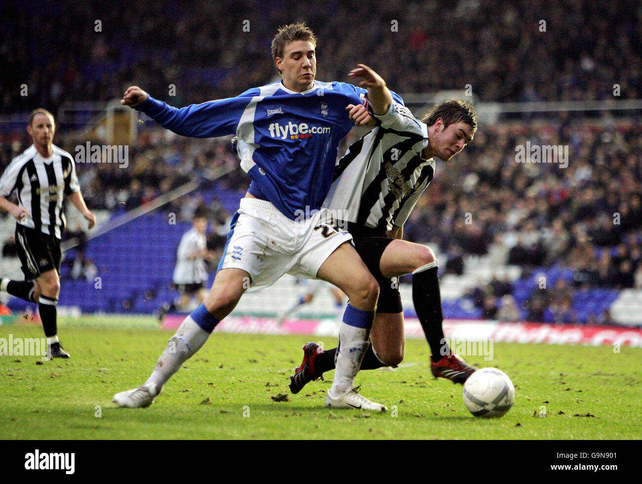 Soccer - FA Cup - Third Round - Birmingham City v Newcastle United - St Andrews. Birmingham's Nicklas Bendtner (left) and Newcastle's Paul Huntington battle during the FA Cup third round match at St Andrews, Birmingham. Stock Photo