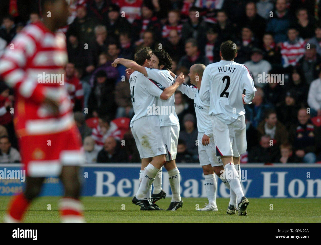 Should read Bolton Athletics Andranik Teymourian is congratulated by Kevin Davies after scoring the second goal against Doncaster during the FA Cup third round match at the Keepmoat Stadium, Doncaster. Stock Photo