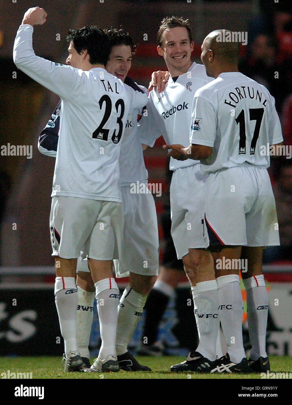 Bolton's Andranik Teymourian (centre) is congratulated by Kevin Davies, Idan Tal (left) and Quinton Fortune after scoring his second goal during the FA Cup third round match against Doncaster at the Keepmoat Stadium, Doncaster. Stock Photo