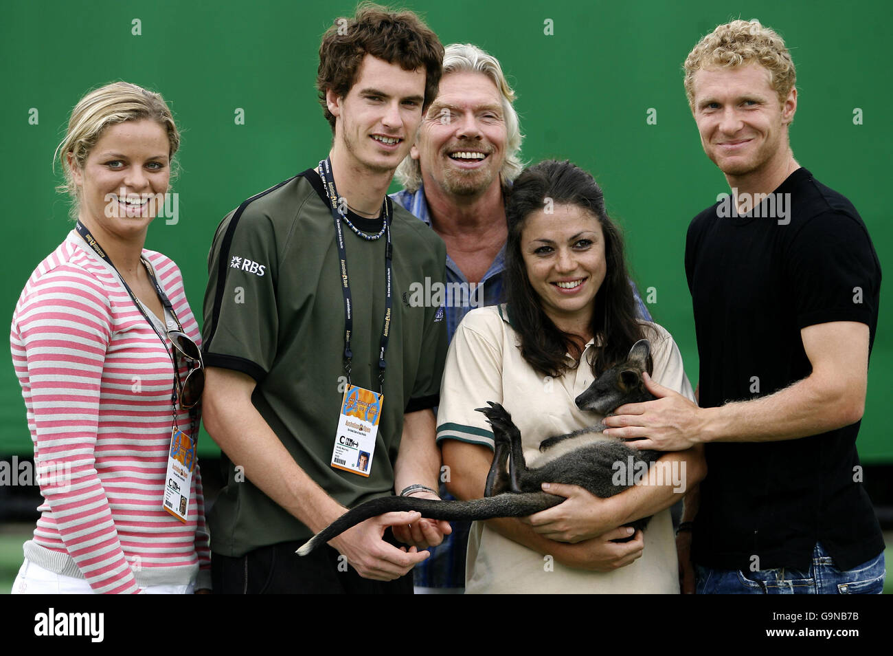 Great Britain's Andy Murray (second left) poses for photographers with Brocky the Wallaby, famous entrepreneur Sir Richard Branson and fellow tennis players, Kim Clijisters (left) and Dmitry Tursunov (right), during a photo-call at the Australian Open in Melbourne Park, Melbourne, Australia. Stock Photo