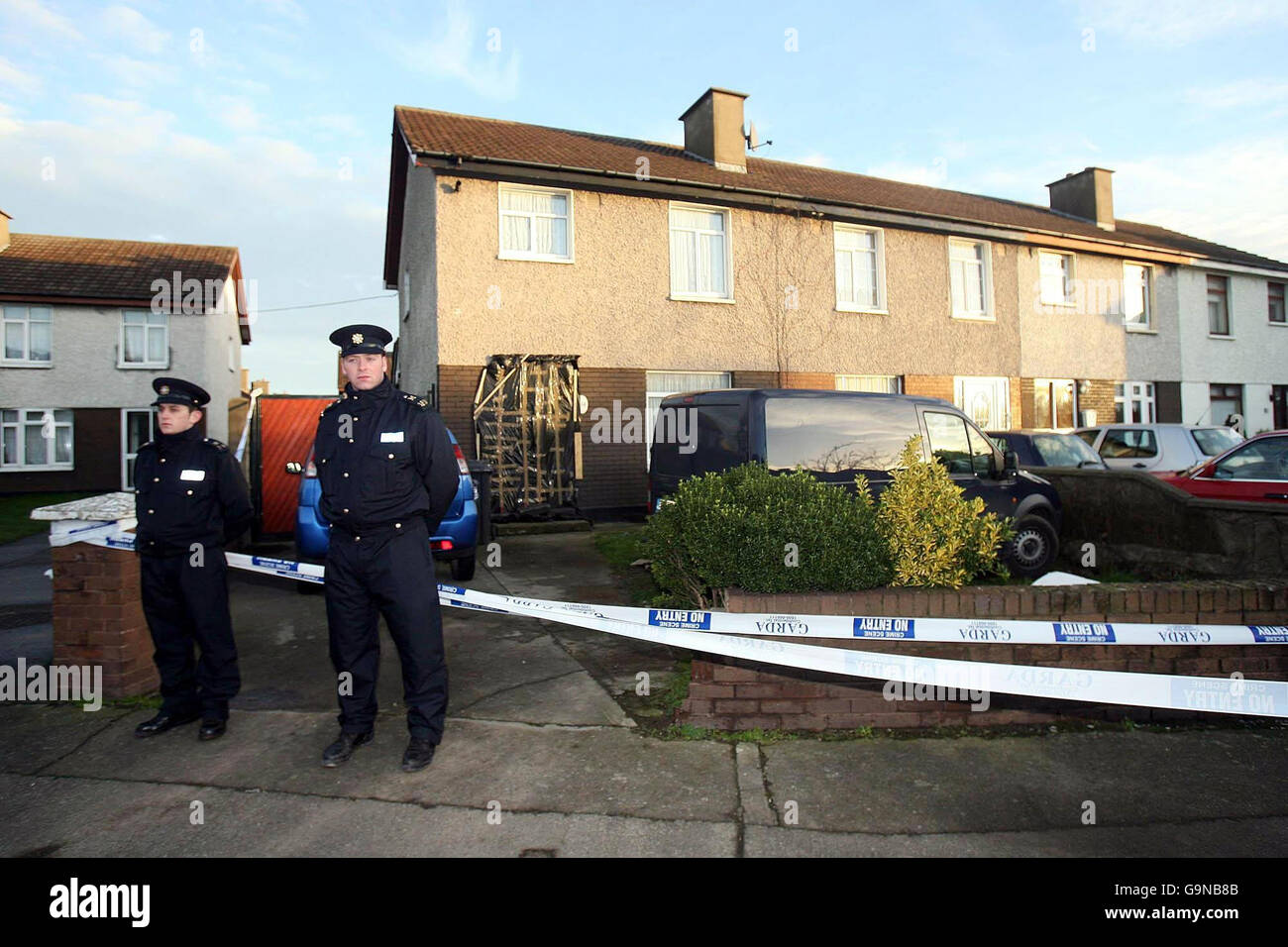 Man stabbed in his own home. Gardai stand at the scene of a fatal stabbing at Tymonville Road, in the Tallaght area of west Dublin. Stock Photo