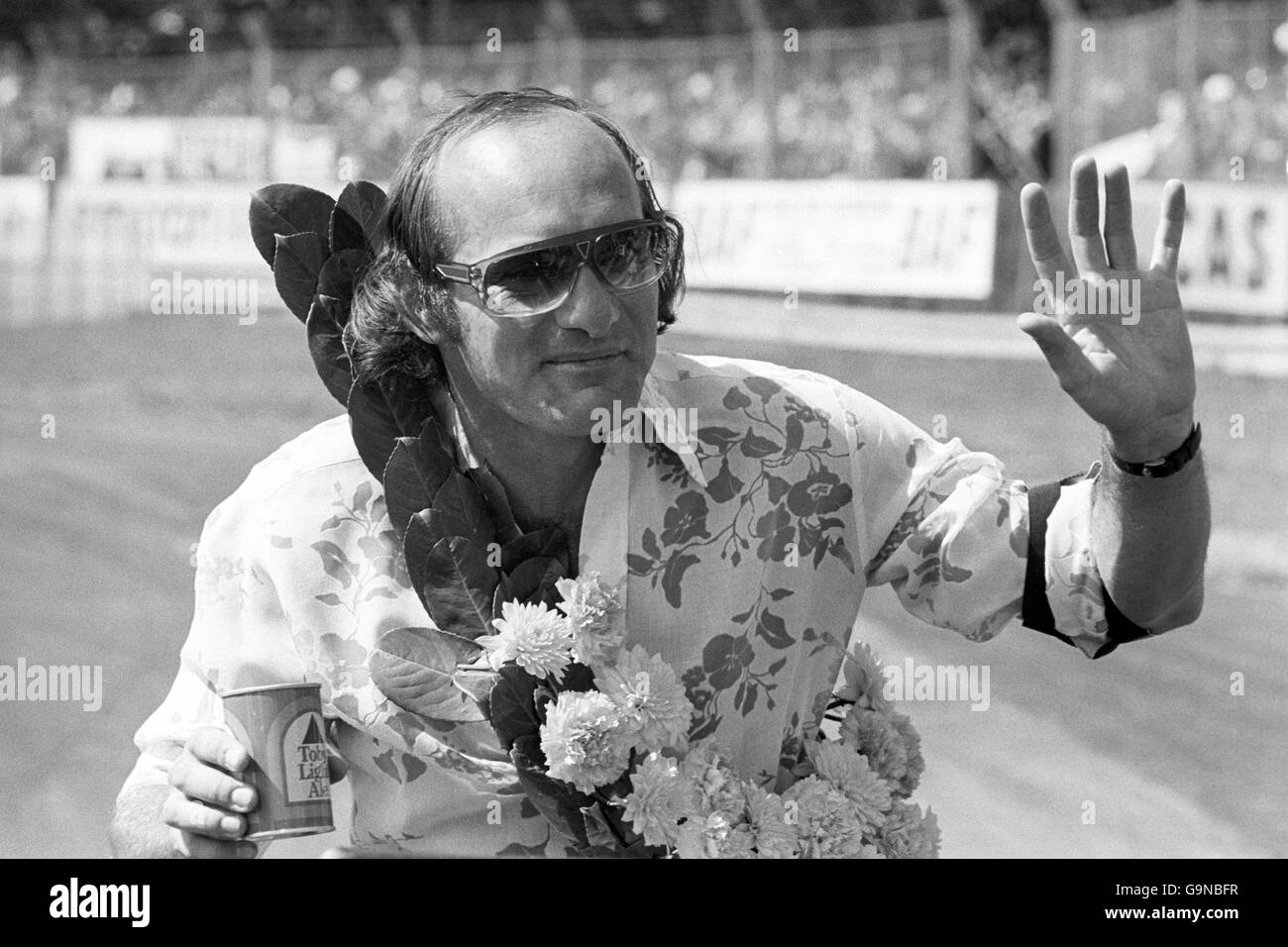 Motorcycling - John Player British Grand Prix - Silverstone. Former world champion Mike Hailwood waves to the crowd as he is driven on a lap of honour Stock Photo