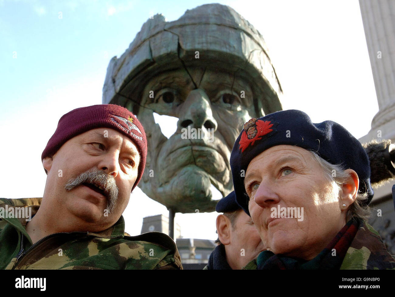 Denzil Connick (left), who lost his left leg on Mount Longdon in the Falkland Islands, talks to Nicci Pugh, a naval nurse who treated his injuries on the Hospital Ship Uganda in 1982, in front of a giant soldier's head in Trafalgar Square, central London during an event organised by the National Gulf Veterans and Families Association. Stock Photo