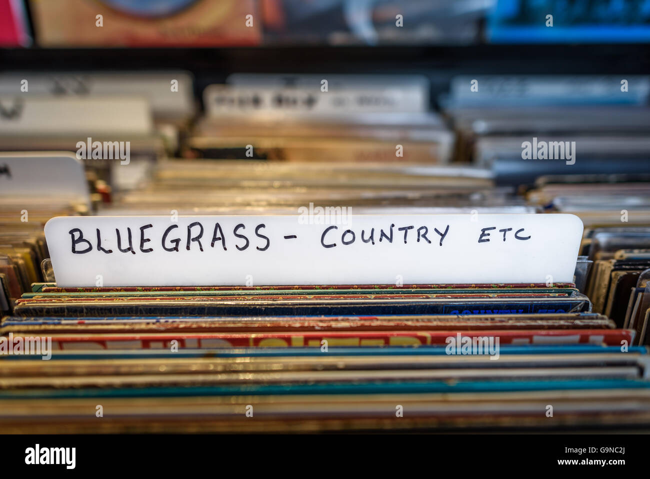 A selection of Bluegrass and Country vinyl albums for sale in a second hand store. Stock Photo