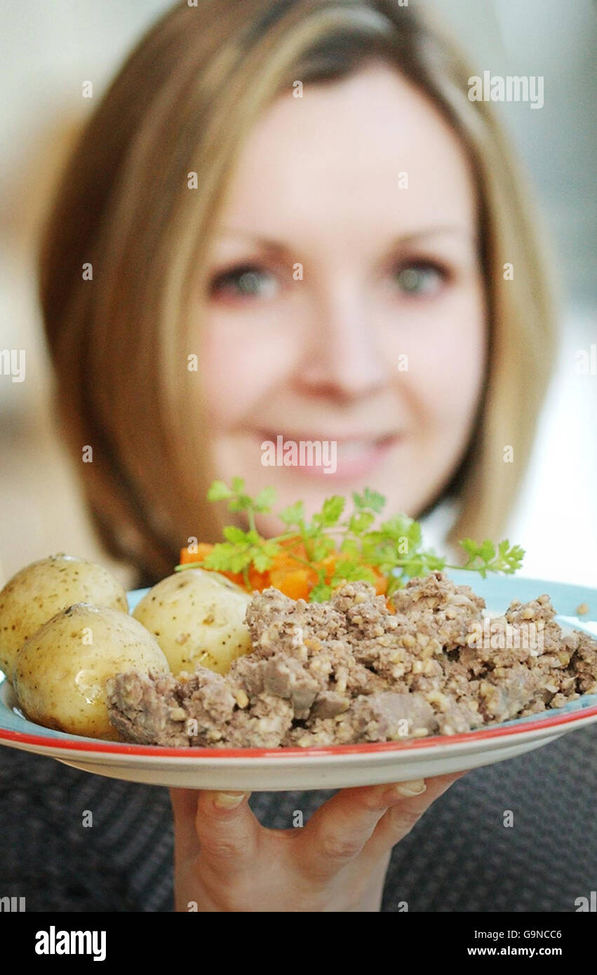 A model holds a haggis, neeps and tatties meal. Stock Photo