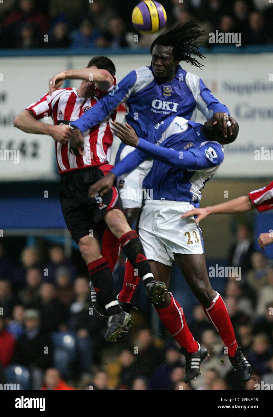 Soccer - FA Barclays Premiership - Portsmouth v Sheffield United - Fratton Park. Portsmouth's Linvoy Primus climbs above two players to win a header Stock Photo
