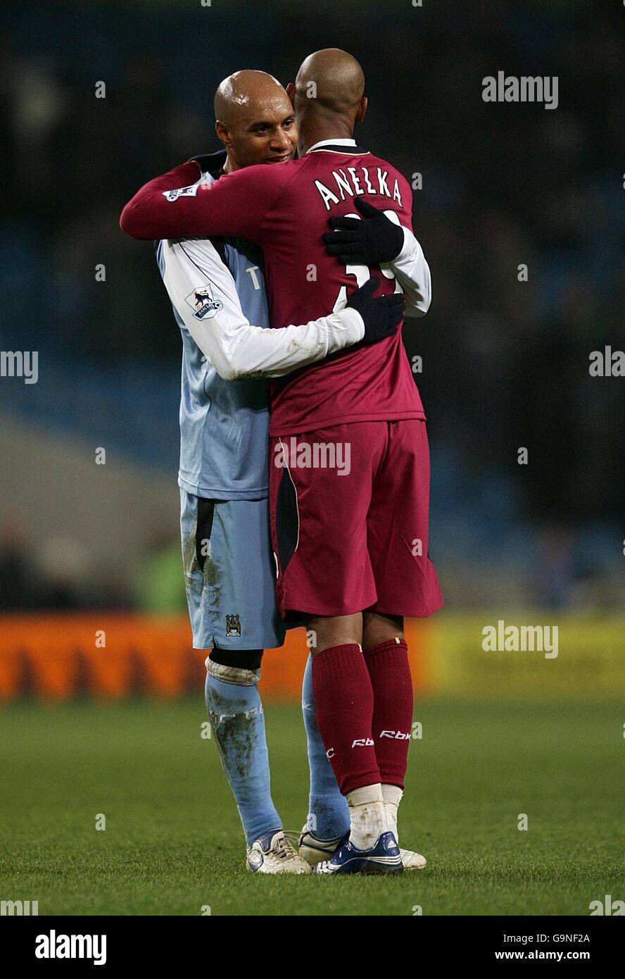 (l-r) Ousmane Dabo, Manchester City congratulates Bolton's Nicolas ...