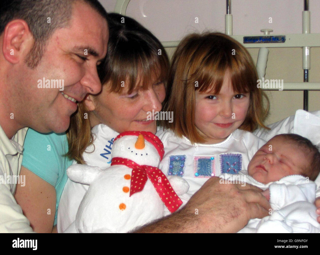 From left, Lee Andrew, his wife Sonni and their 3-year-old daughter Beth from Ellon, Aberdeenshire, with the family's new arrival, Zoe at Glasgow's Priness Royal Maternity Hospital. Stock Photo