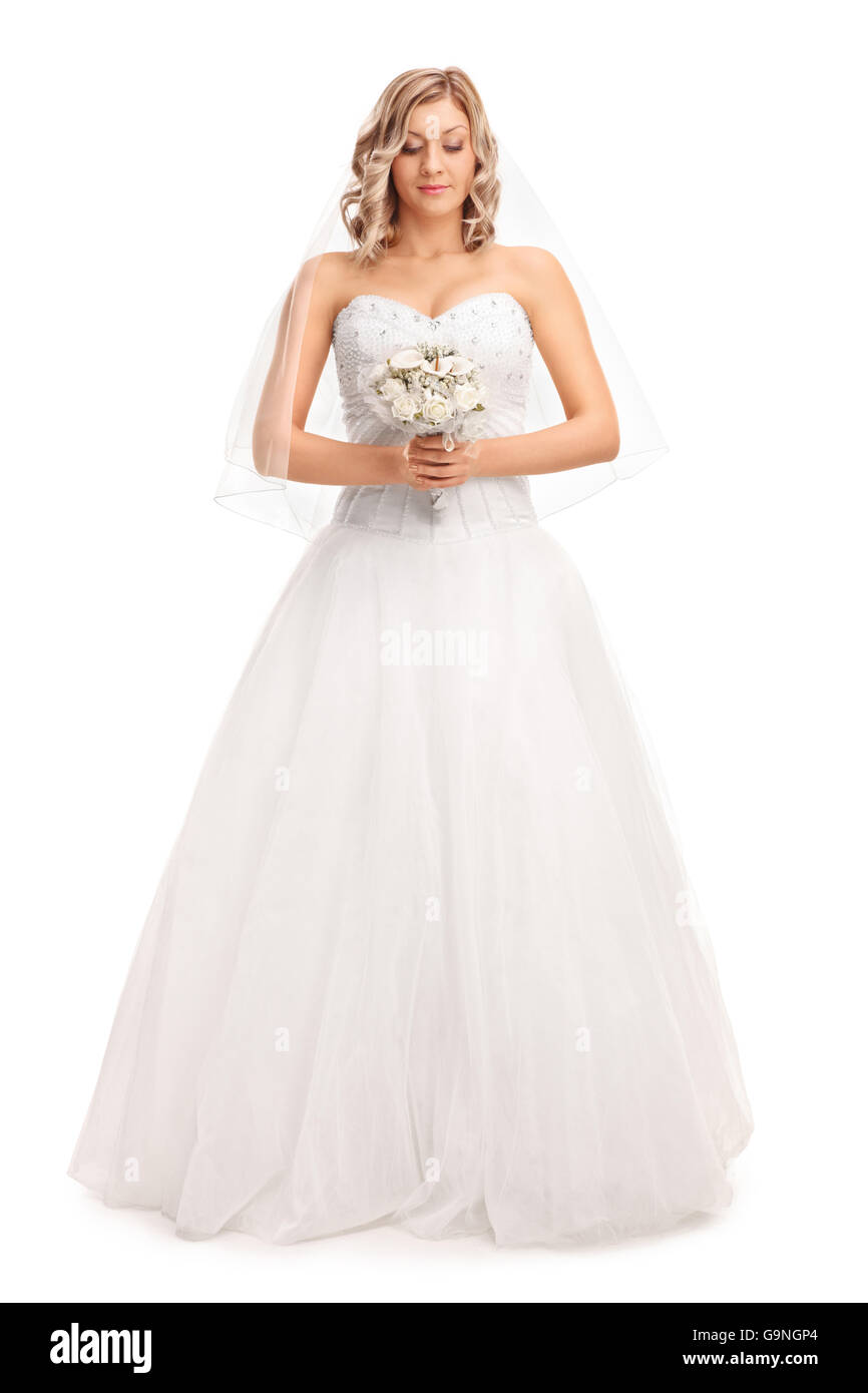 Full length portrait of a blond bride in a white wedding dress holding ...
