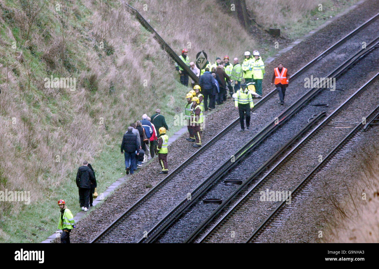 Passengers are lead to safety after a landslide derailed a train near Redhill, Surrey. Stock Photo