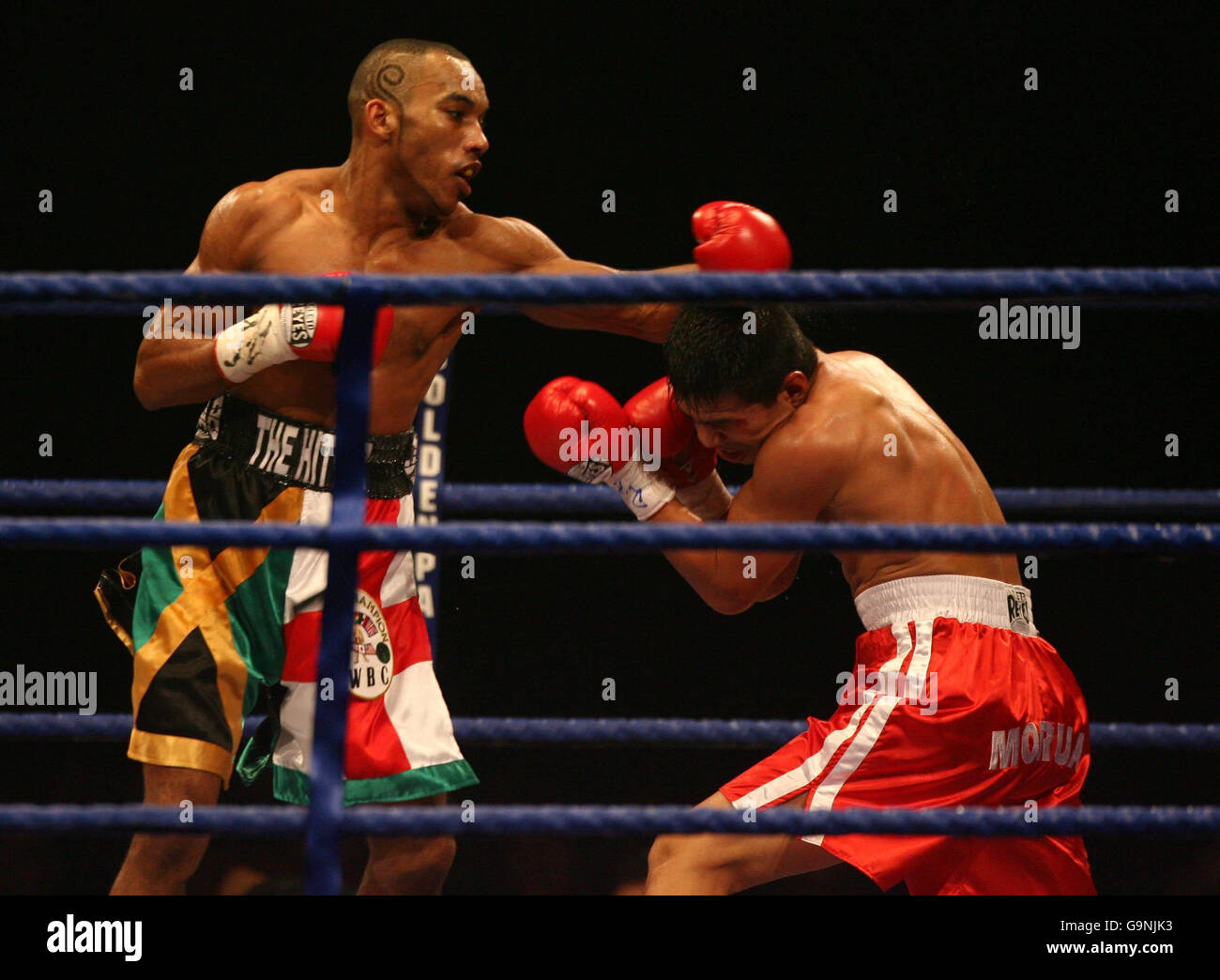 England's Junior Witter (left) in action against Mexico's Arturo Morua during the WBC Light Welterweight Title bout at Alexandra Palace, London. Stock Photo