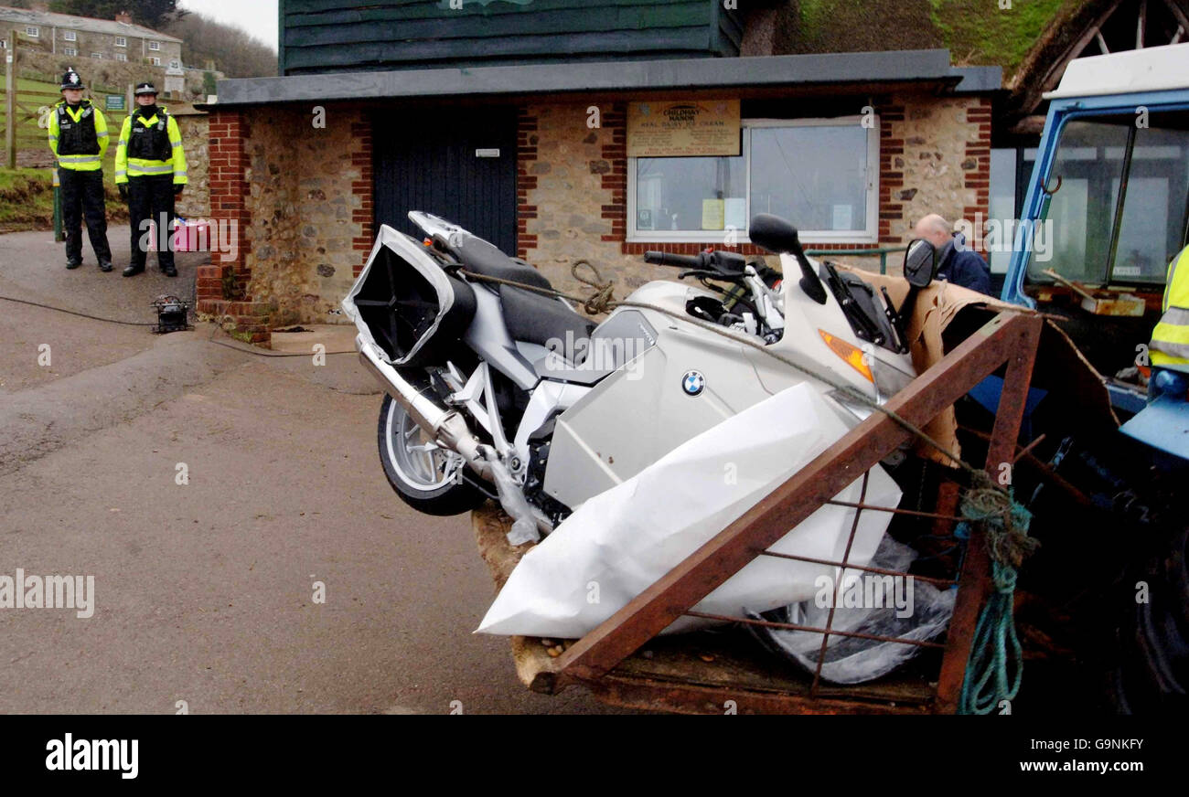 MSC Napoli beached off Devon coast. A BMW motorbike is taken away by a tractor from Branscombe beach in Devon. Stock Photo