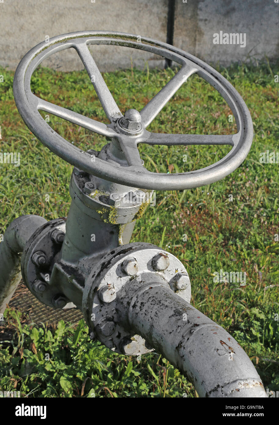 iron gate valve to close or open the natural gas flow from the