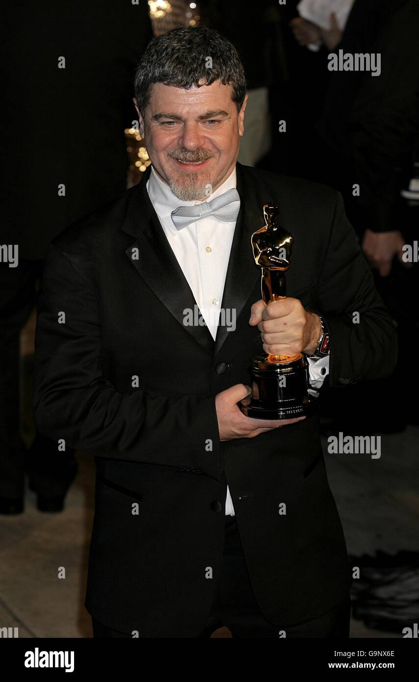 Gustavo Santaolalla poses with the Oscar for best original score for his work on 'Babel' as he arrives for the annual Vanity Fair Party at Mortons Restaurant, Los Angeles. Stock Photo
