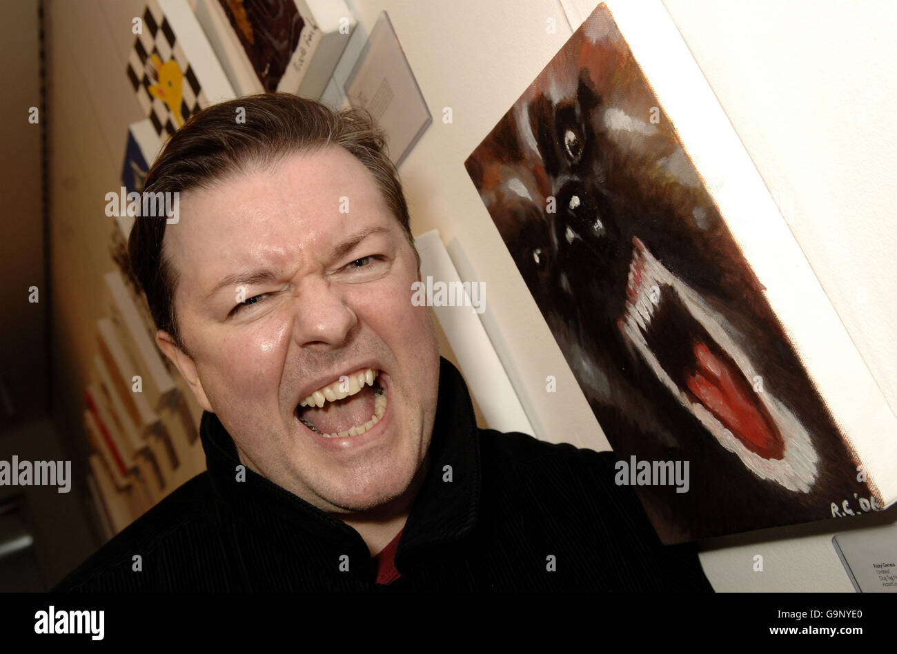 Dog Project private view and auction - London. Ricky Gervais next to