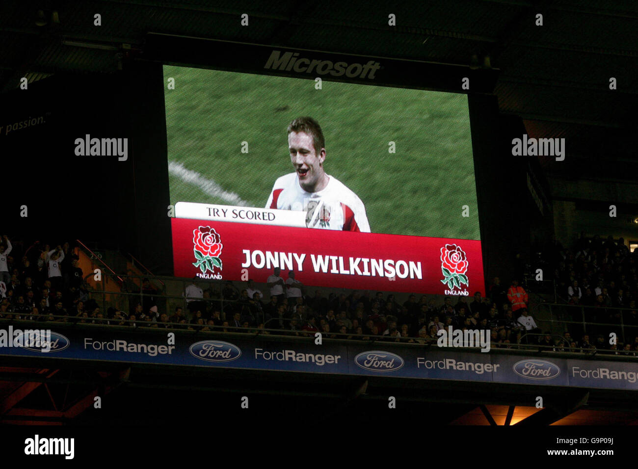 England's Jonny Wilkinson smiles after his try is awarded against Scotland on the large screen during the RBS 6 Nations match at Twickenham, London. Stock Photo