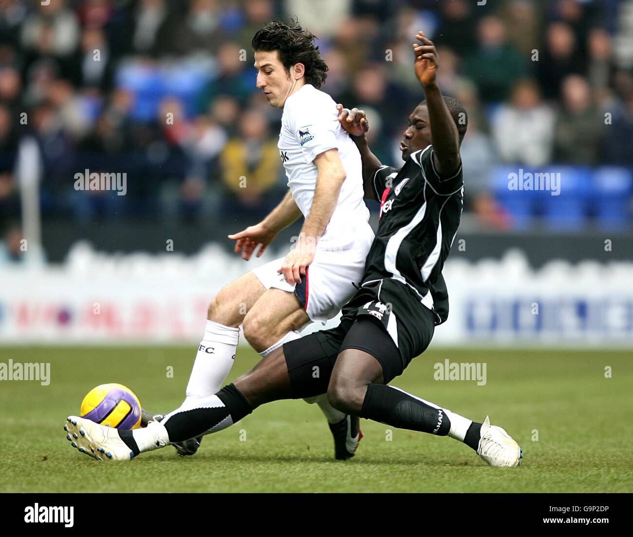 Bolton Wanderers' Andranik Teymourian (l) and Fulham's Papa Bouba Diop (r) battle for the ball Stock Photo