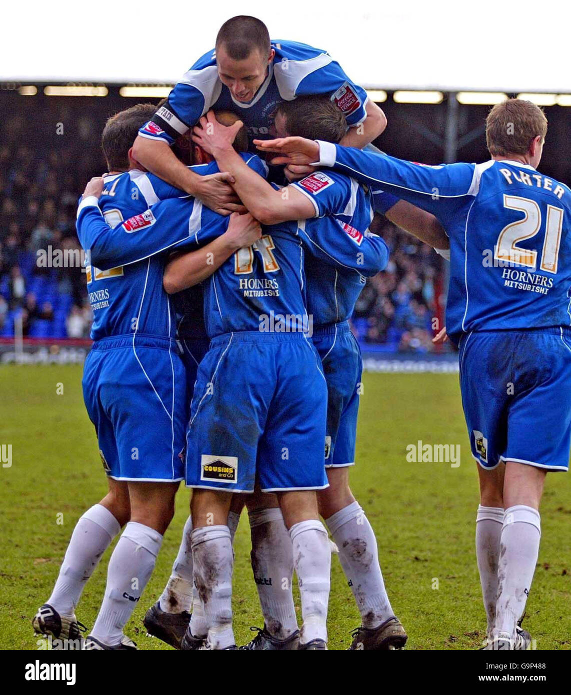 Oldham's Paul Warne (centre) celebrates his goal with team-mates during the Coca-Cola League One match at Boundary Park, Oldham. Stock Photo