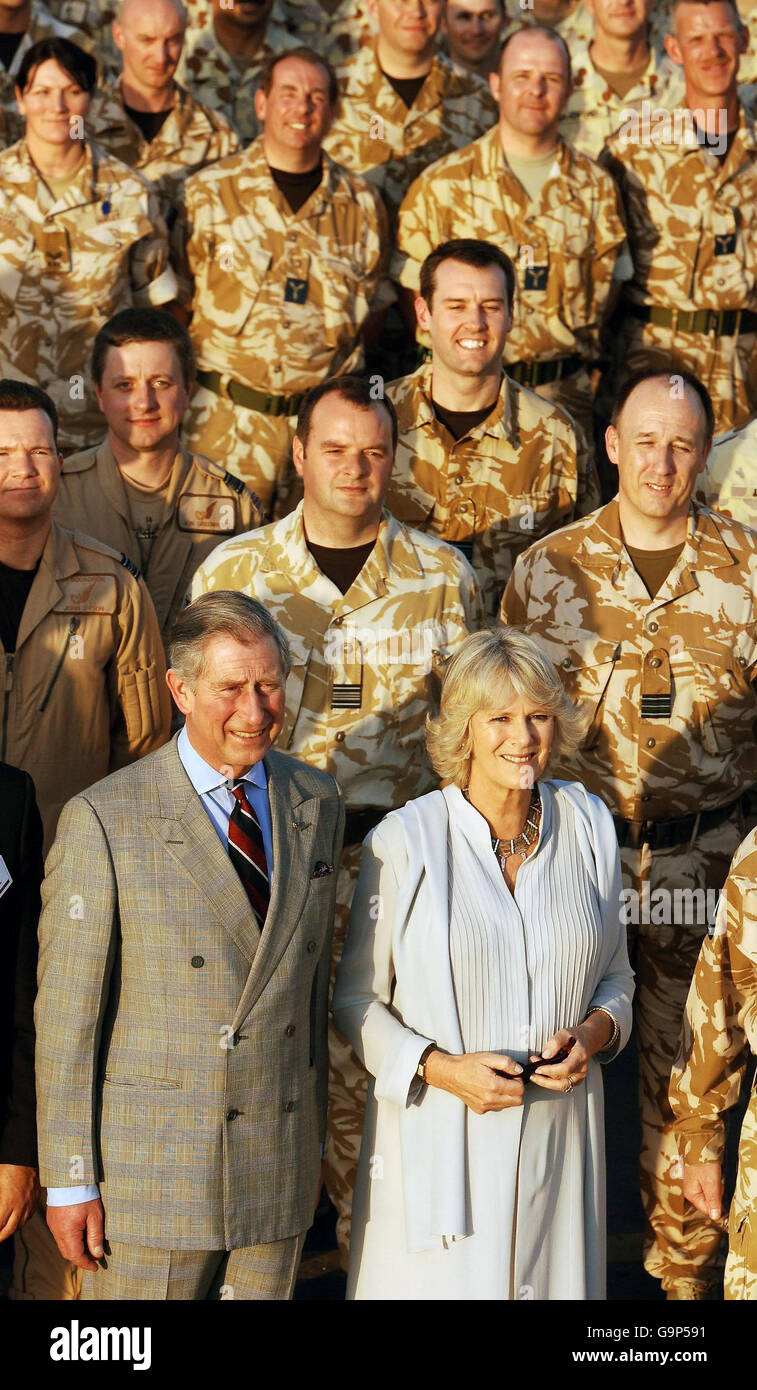 The Prince of Wales and the Duchess of Cornwall pose for a group photo with a detachment of RAF Tornado aircrew, during a visit to the US Airbase Al Udeid outside Doha in Qatar, this afternoon. Stock Photo