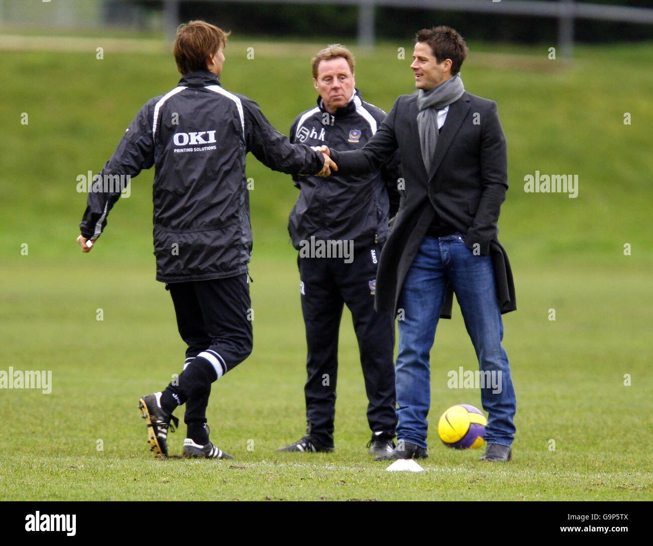 Portsmouth manager Harry Redknapp (centre) watches as assistant manager Tony  Adams (left) greets Jamie Redknapp during a training session at their  training ground, near Southampton Stock Photo - Alamy