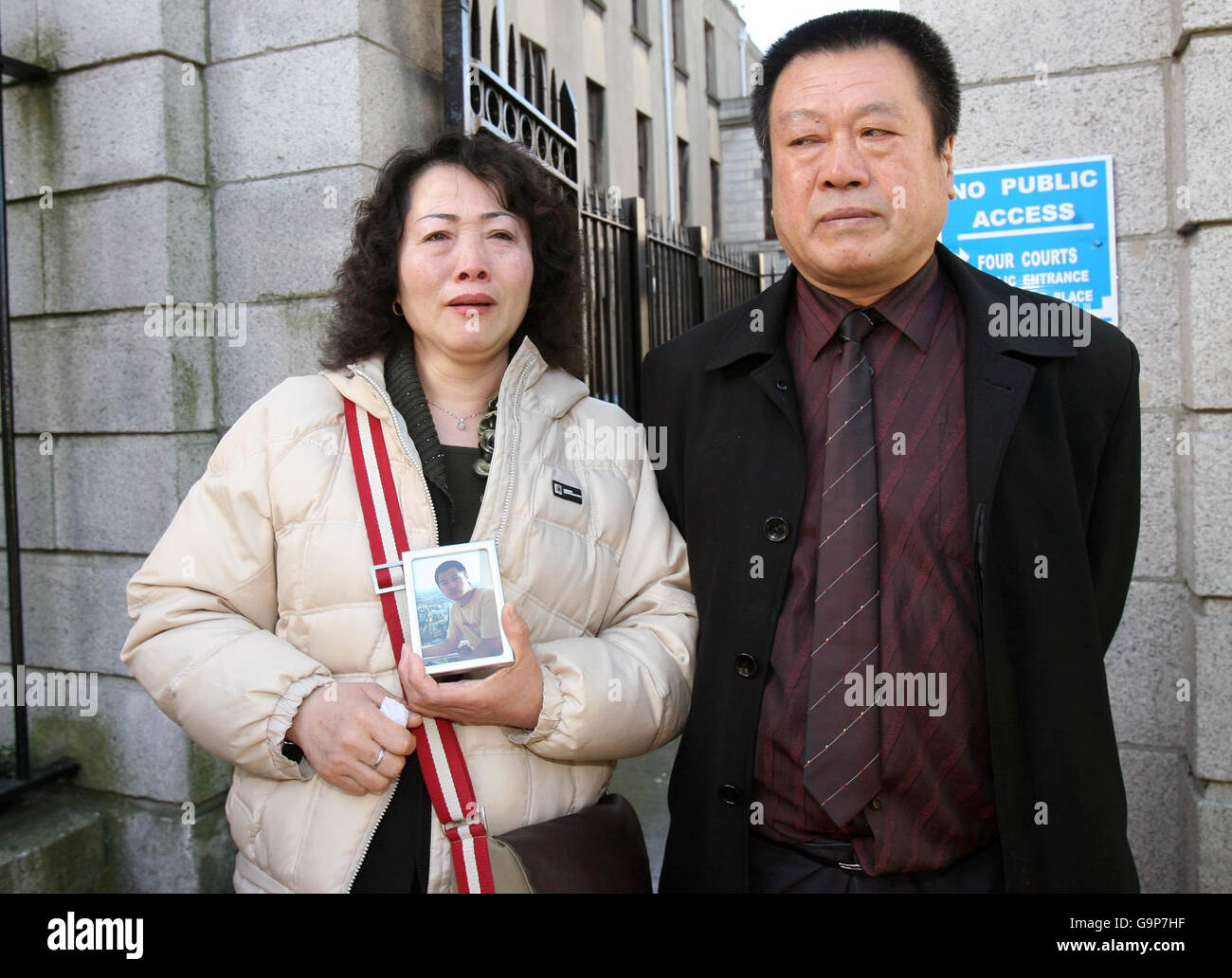 Derek Wade trial. Chun Xiang Zhang and Ji Dong Song, parents of Song Zhi, outside Dublin's High Court. Stock Photo