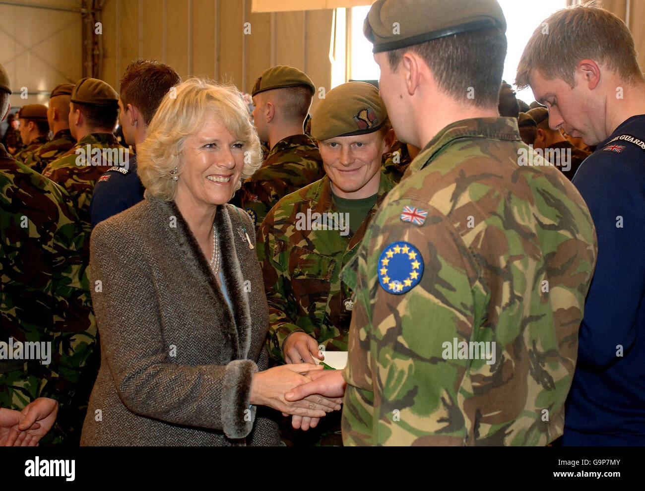 The Duchess of Cornwall holds a ceremonial leek, marking St David's Day, as she meets Welsh Guards at the Banja Luka Metal Factory in Bosnia. Stock Photo