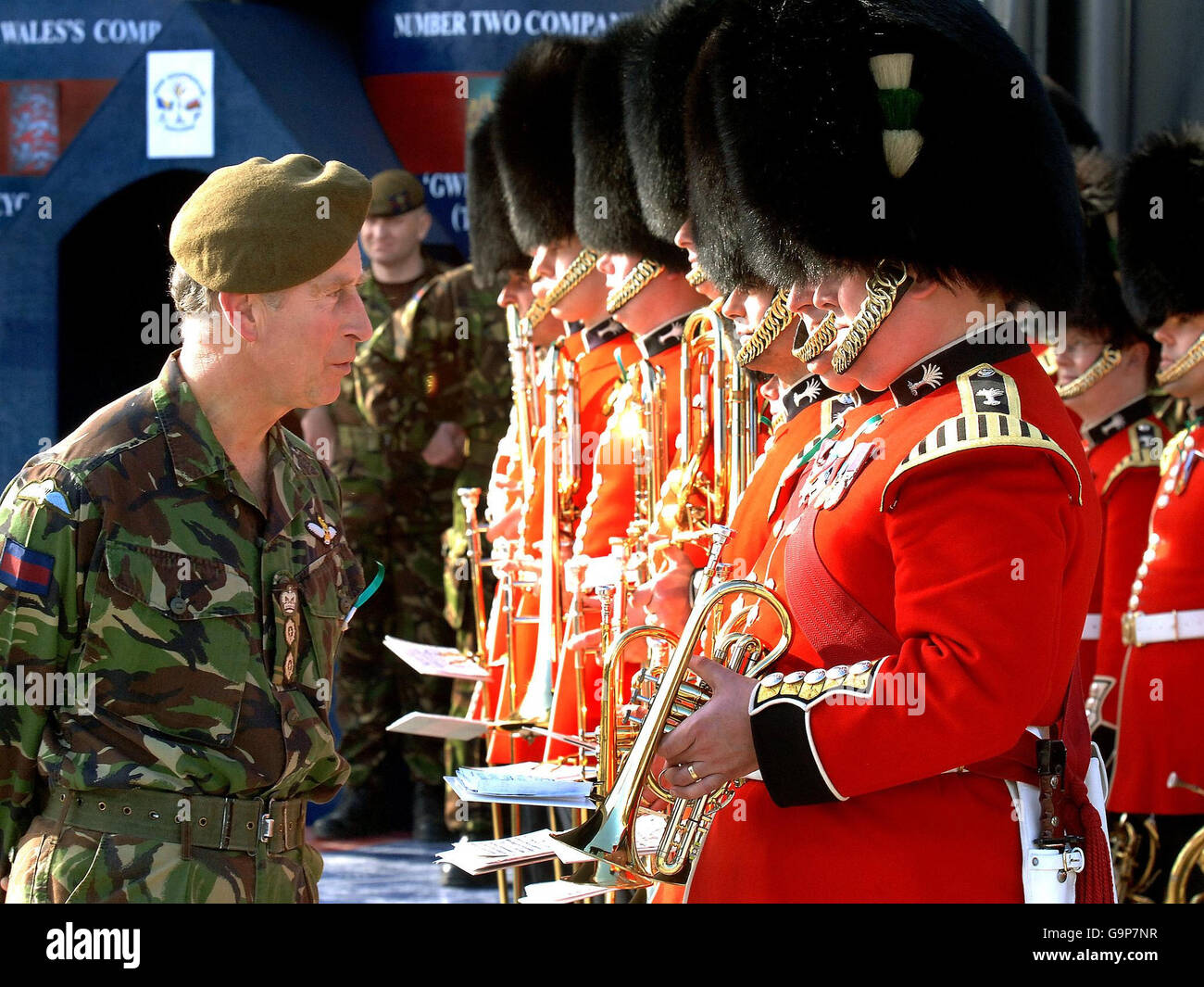 The Prince of Wales in uniform, as the Colonel-in-Chief of the Welsh Guards, speaks to band members at Banja Luka Metal Factory in Bosnia. Stock Photo