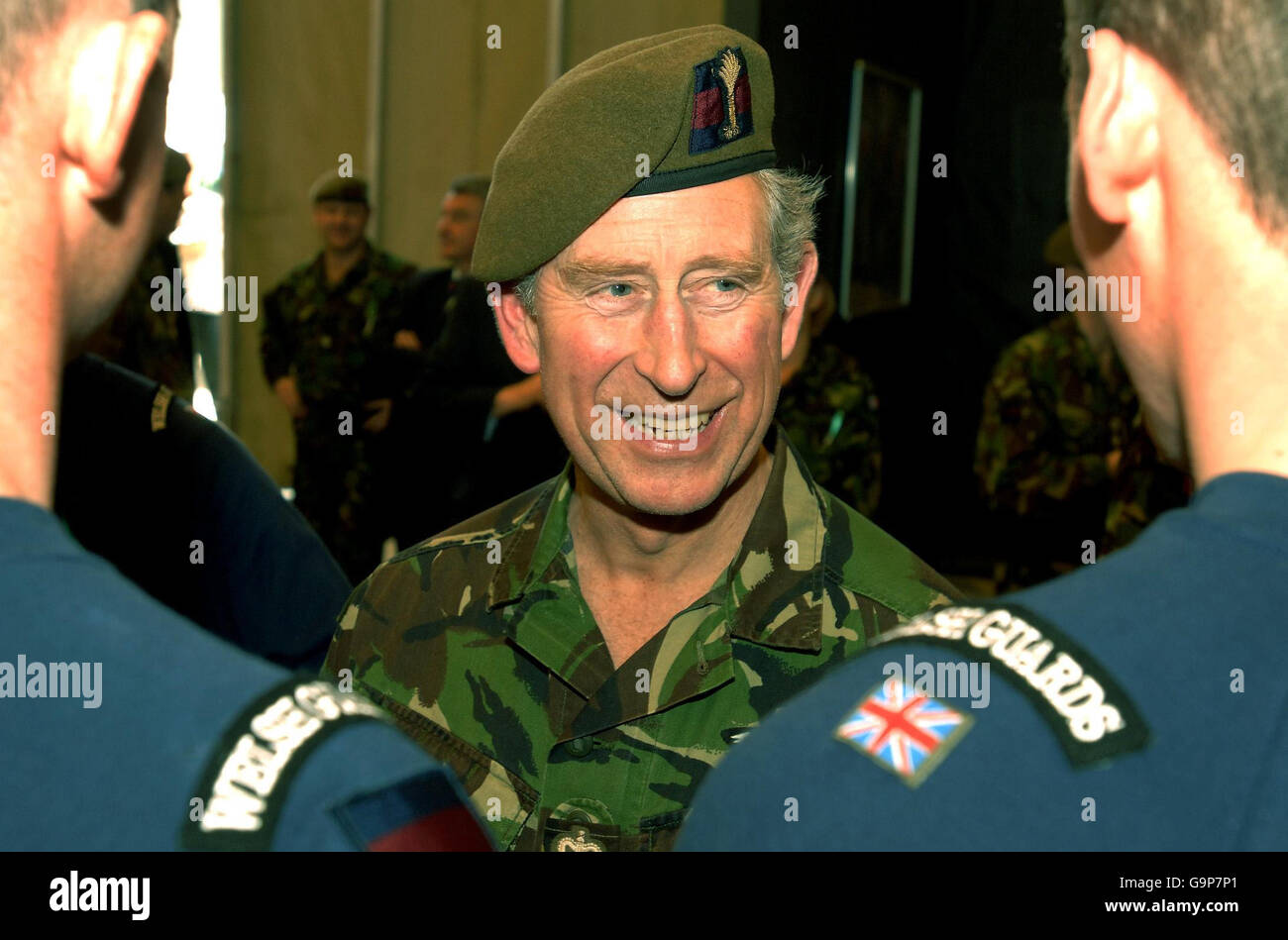 The Prince of Wales, in uniform as the Colonel-in-Chief of the Welsh Guards, speaks to members of the Iron Guardsmen team at Banja Luka Metal Factory in Bosnia. Stock Photo
