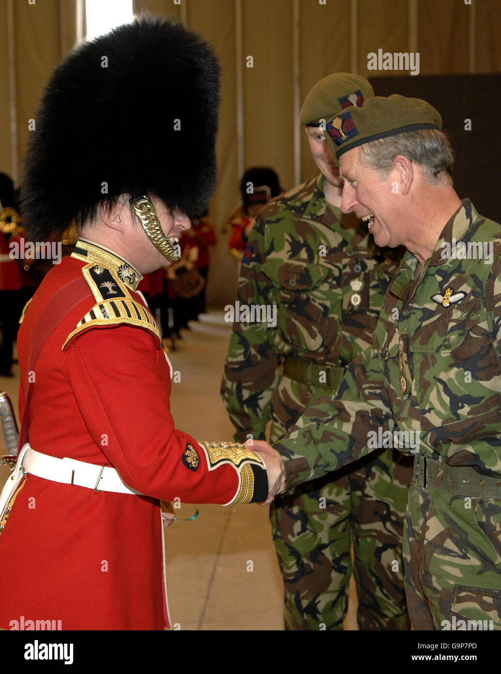 The Prince of Wales (right) shakes hands with the bandleader of the Welsh Guards after presenting him with a ceremonial leek, marking St David's Day, at the Banja Luka Metal Factory in Bosnia. Stock Photo