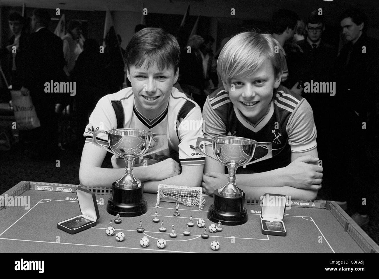 Table soccer stars Darrell Dunscombe (left) of Stockport and Justin Finch of Coventry with their trophies after darrell, 16, won the senior and Justin, 15, the junior Subbuteo World British finals at the Ladbroke International Hotel in Wembley today. Stock Photo