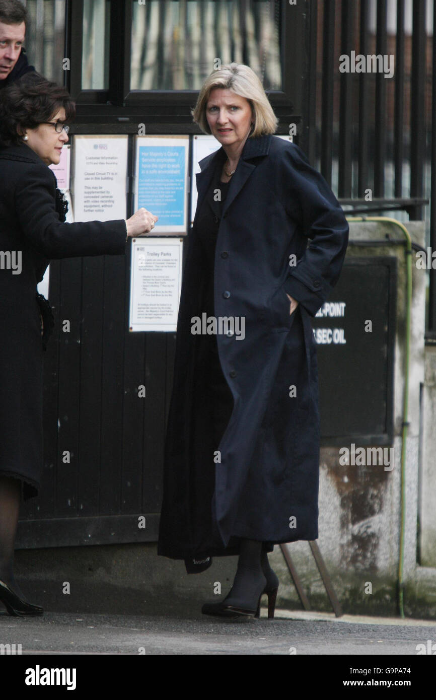 Beverley Charman, whose ex-husband John Charman is today trying to claw back from his former wife more than half the biggest divorce award in British legal history, leaves the High Court in London with an unidentified man. Stock Photo